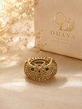 Gold owl ring with emerald crystal eyes and pavé detailing by Ohana Design