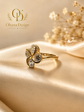 Gold four-petal flower ring with brilliant-cut crystals by Ohana Design