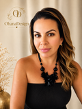 Model wearing black floral statement necklace with gold Ohana Design logo
